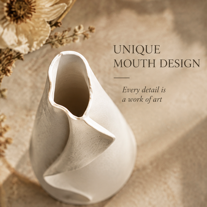 Top view of the cream ceramic ribbon vase showing its distinctive irregular opening