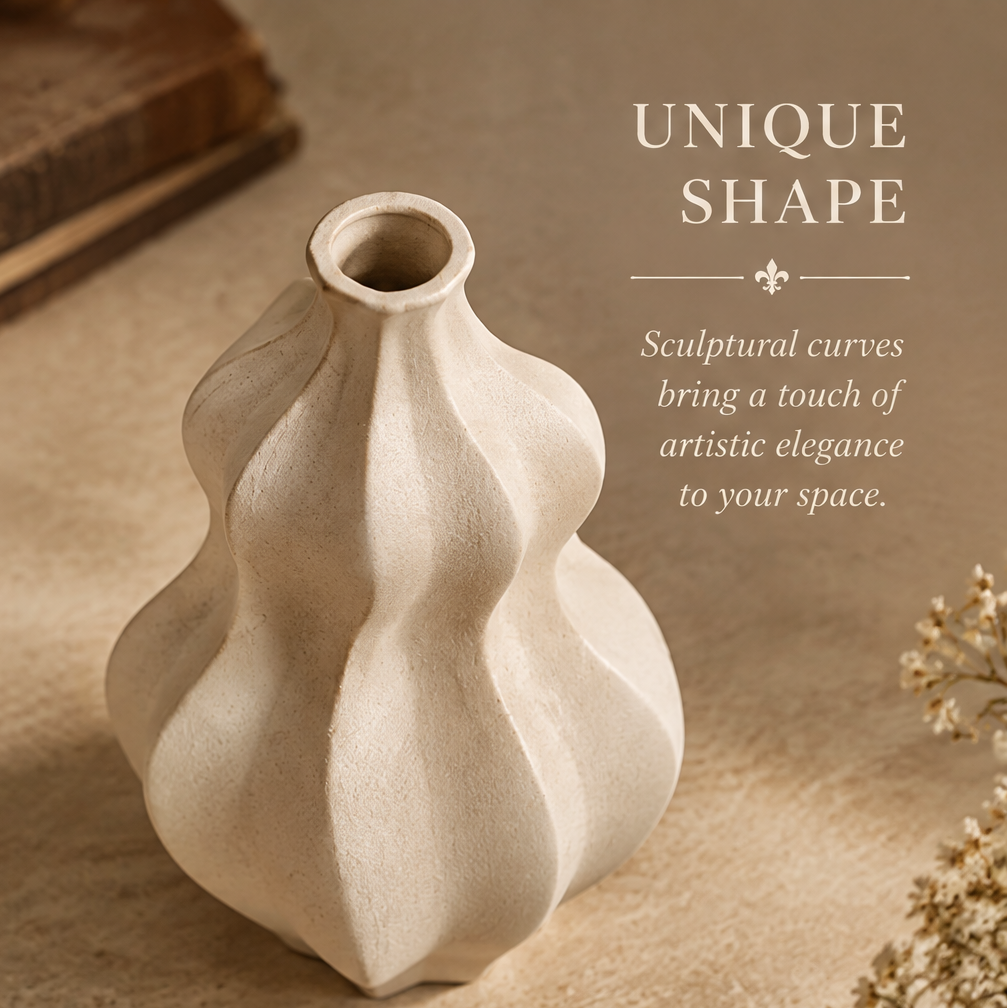 Top view of the cream ceramic wave vase showing its round opening and sculptural curves