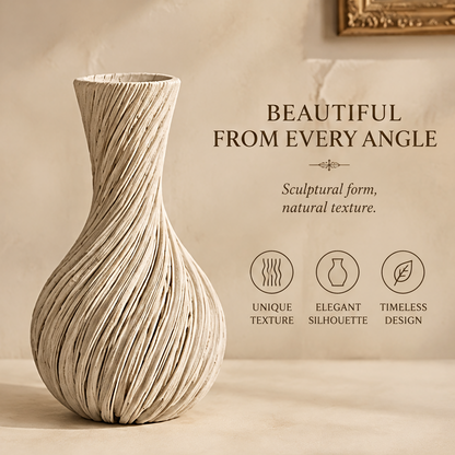 Cream spiral teardrop vase shown in full view with flowing ridges, a rounded base, and a flared neck